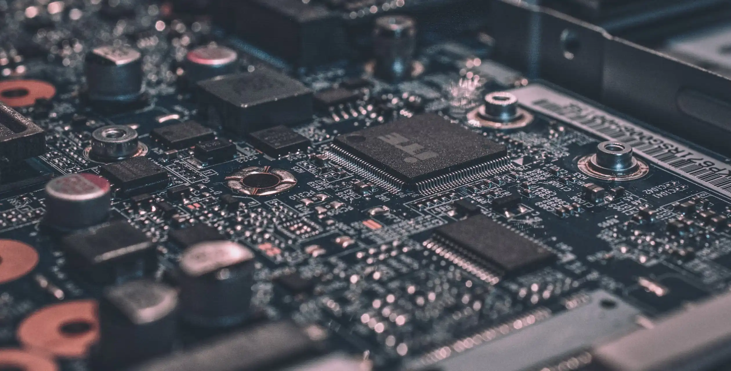 Close-up view of a computer motherboard showing chips and circuits